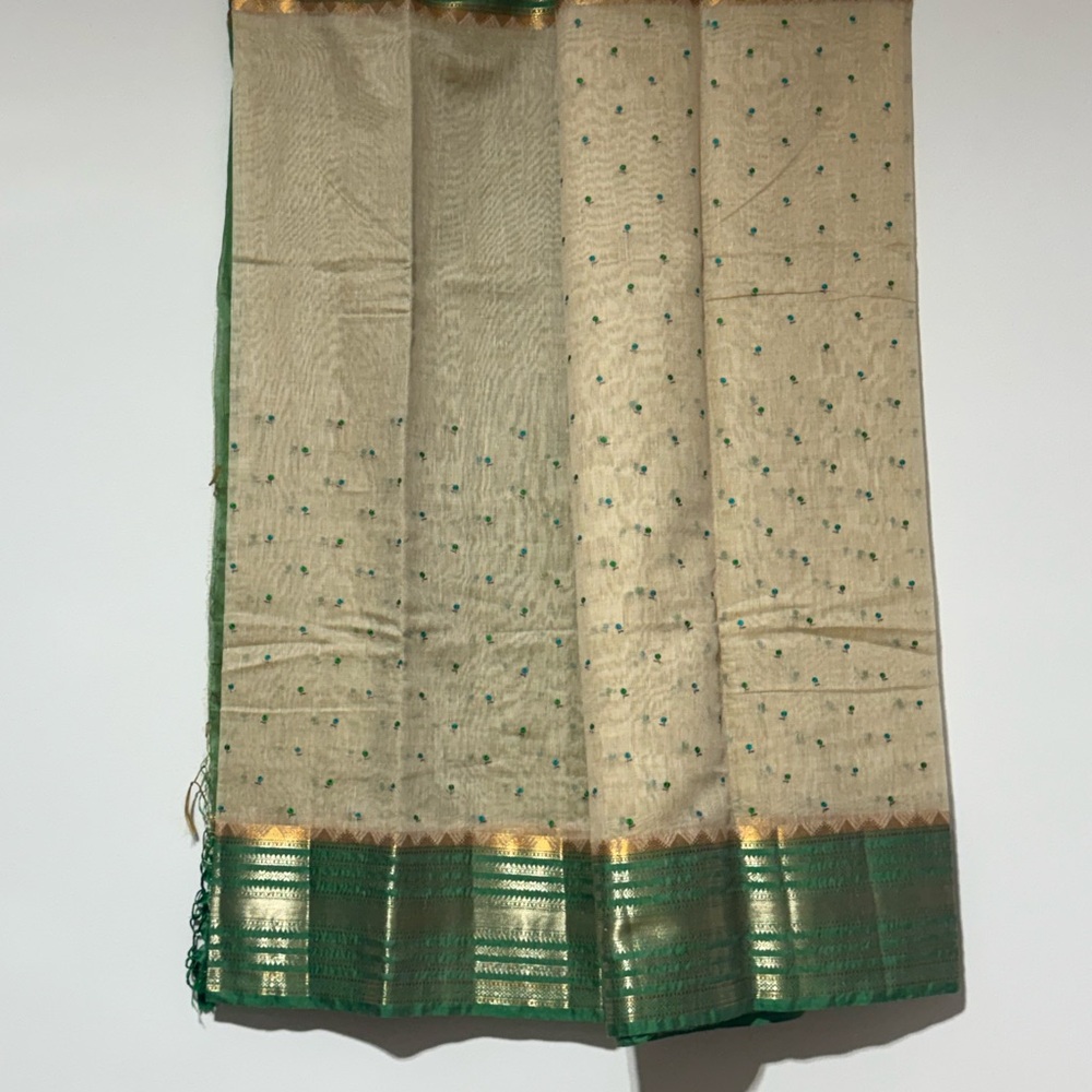 Elegant Cream and Green Saree with Gold Accents